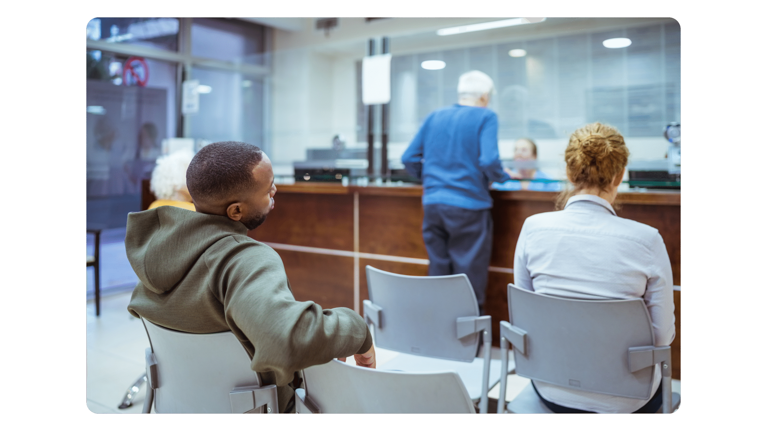 People waiting in an NHS Waiting Room